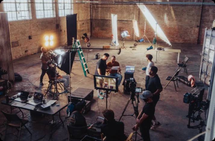 Film crew on a large studio set seen from above